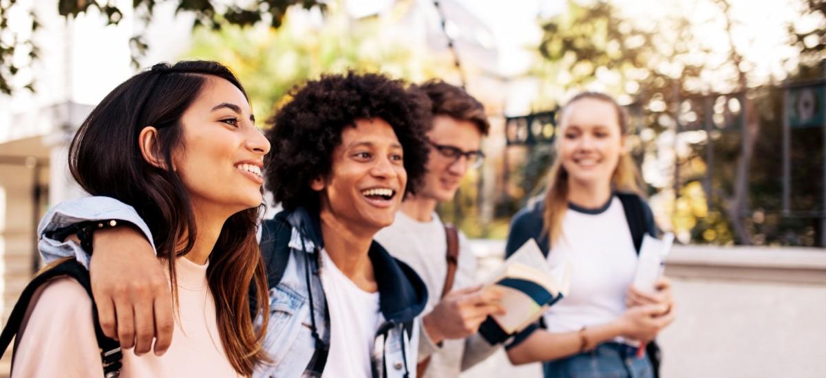 4 students walking outside